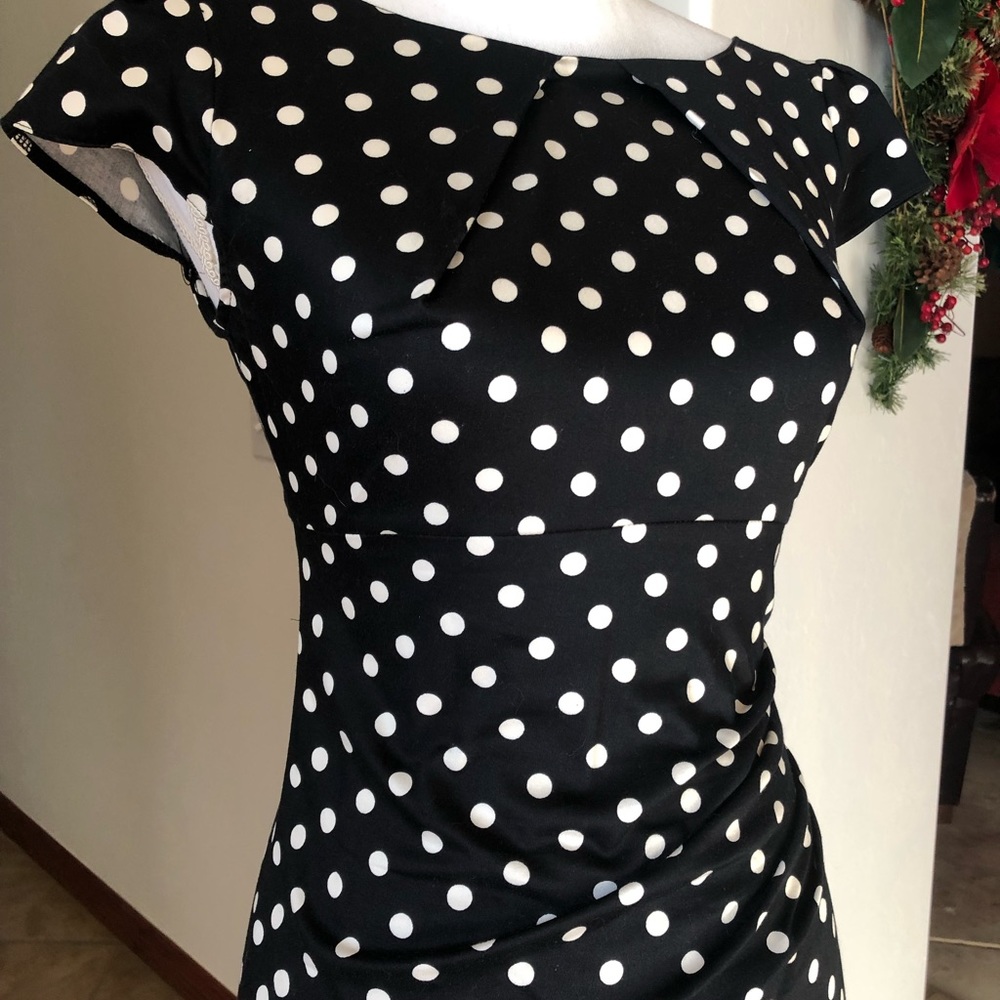 Form fitting petite black and white polka dot dress.